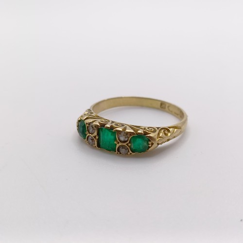 424 - An 18ct gold, emerald and diamond ring, ring size O