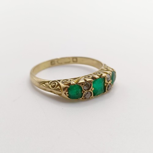 424 - An 18ct gold, emerald and diamond ring, ring size O