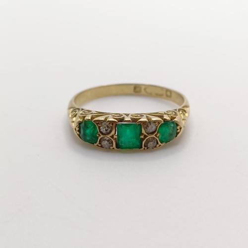 424 - An 18ct gold, emerald and diamond ring, ring size O