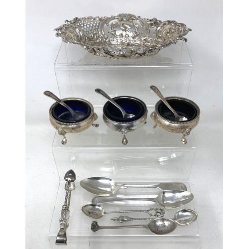 242 - A set of three silver salts, assorted spoons and a pierced dish, various dates and marks (13)