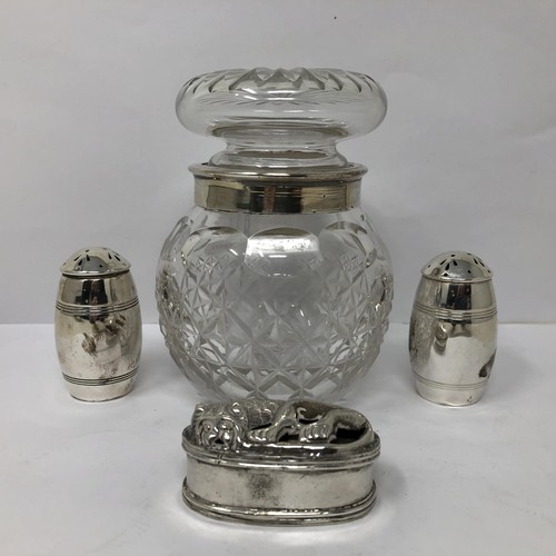 243 - A cut glass vase, with a silver mount, a pair of peppers and a silver coloured metal box, decorated ... 