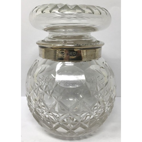 243 - A cut glass vase, with a silver mount, a pair of peppers and a silver coloured metal box, decorated ... 