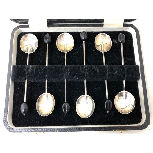 246 - A set of six George V silver and green enamel coffee spoons, and a set of six coffee spoons (12)