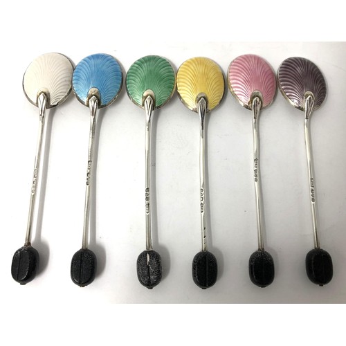 250 - A set of six George V silver and multi-coloured enamel coffee spoons, with carved wooden bean finial... 