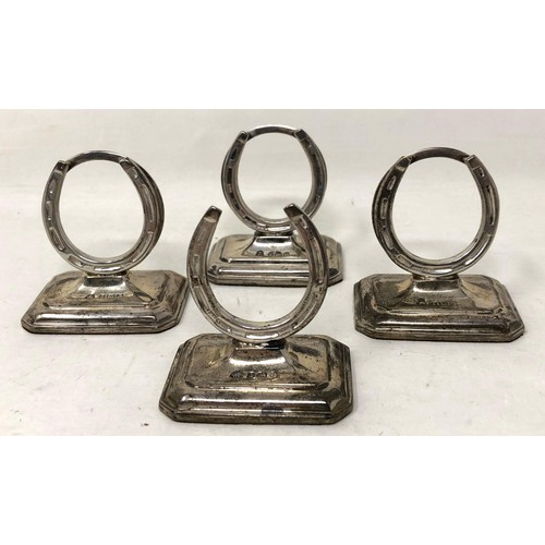 252 - A set of Edward VII silver novelty menu holders, in the form of horseshoes, Birmingham 1904, cased