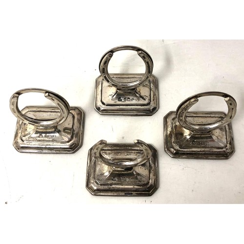 252 - A set of Edward VII silver novelty menu holders, in the form of horseshoes, Birmingham 1904, cased