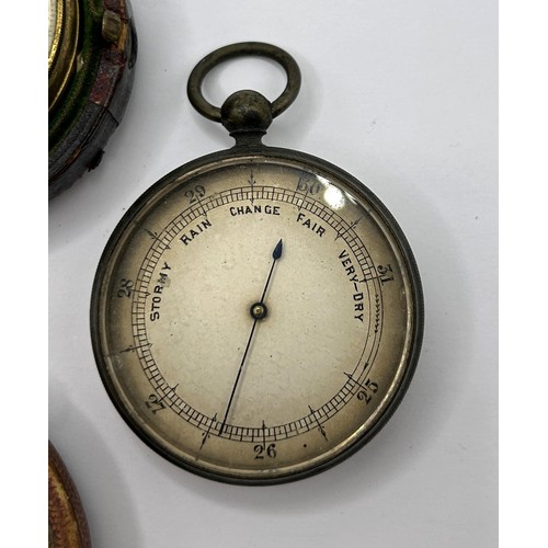 365 - A pocket barometer, by Negretti & Zambra of London, No 18499, cased, another, cased, and another... 