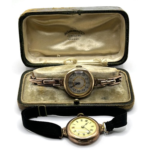 368 - A ladies yellow coloured metal wristwatch, on a silk strap, with a worn vintage watch box, and a lad... 