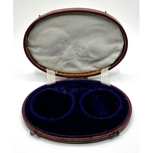 379 - An early/mid 19th century French oval box, to hold two pocket watches, the cover tooled in gilt 'DON... 