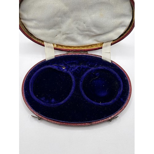 379 - An early/mid 19th century French oval box, to hold two pocket watches, the cover tooled in gilt 'DON... 