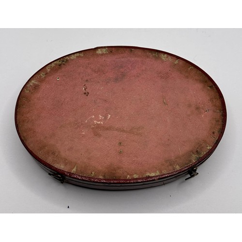 379 - An early/mid 19th century French oval box, to hold two pocket watches, the cover tooled in gilt 'DON... 