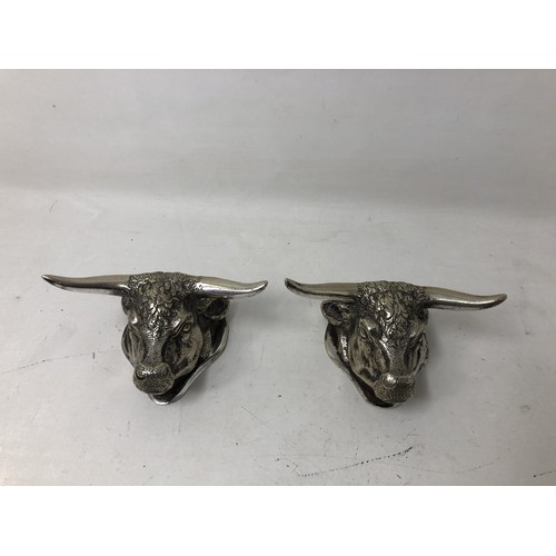 257 - A pair of silver plated knife rests, in the form of bull heads, a silver pepper and salt, a silver c... 