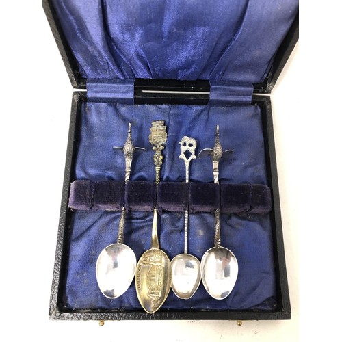 258 - A pair of silver coloured metal spoons, with bird finials, and two other spoons (4)