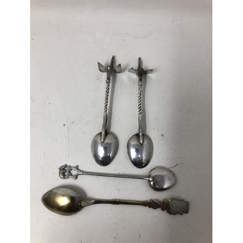 258 - A pair of silver coloured metal spoons, with bird finials, and two other spoons (4)