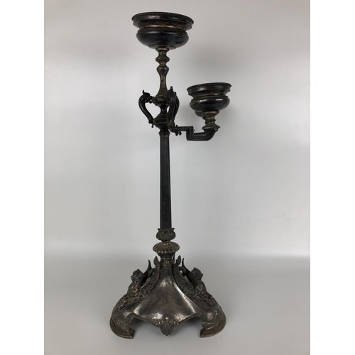 261 - A Victorian silver candelabrum, lacking one branch, the base with griffin mounts, with a presentatio... 