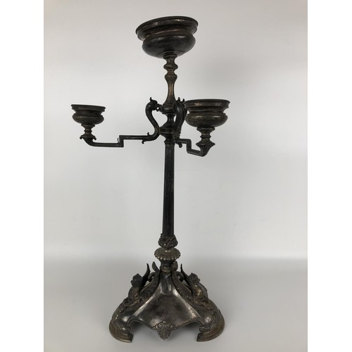 261 - A Victorian silver candelabrum, lacking one branch, the base with griffin mounts, with a presentatio... 