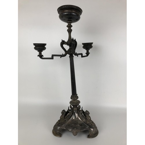 261 - A Victorian silver candelabrum, lacking one branch, the base with griffin mounts, with a presentatio... 