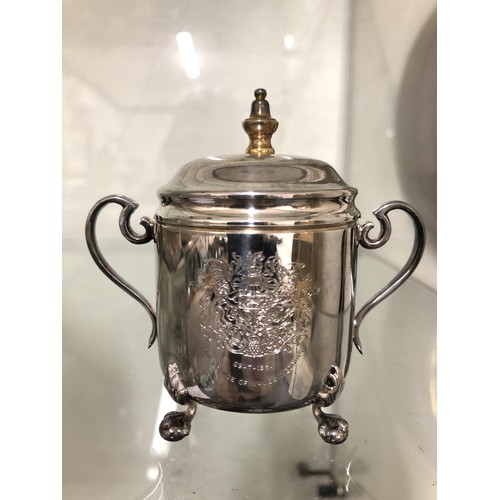 287 - An Elizabeth II cup and cover, 3.5 ozt, cased, a silver backed brush, a silver plated twin handle tr... 