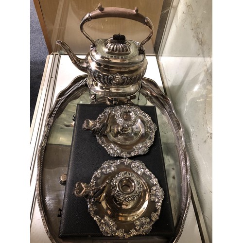 284 - A silver plated kettle on stand, a pair of chambersticks, a set of fish knives and forks, and an ova... 