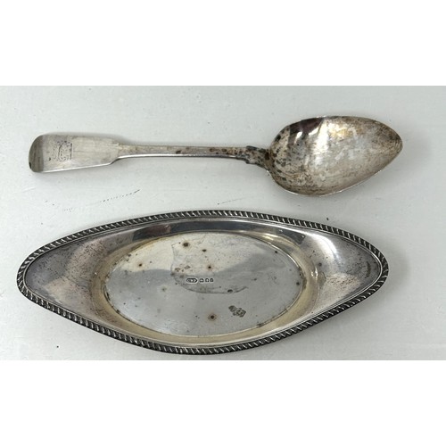 310 - A silver stand, a pair of sugar tongs, a ladle, and a fiddle pattern spoon, various dates and marks,... 