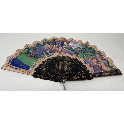 802 - A Chinese lacquered fan, decorated figures, paper painted interior scene, 9.5 cm