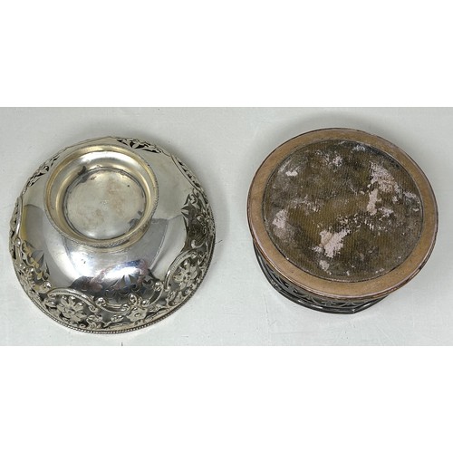 312 - A silver coloured metal pierced bowl, and a silver plated bottle coaster (2)