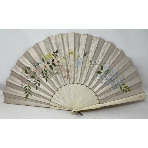 803 - A carved giltwood fan, with pierced decoration, silk decorated butterflies, 10 cm, and two other fan... 