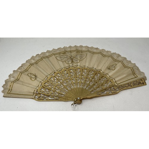 803 - A carved giltwood fan, with pierced decoration, silk decorated butterflies, 10 cm, and two other fan... 