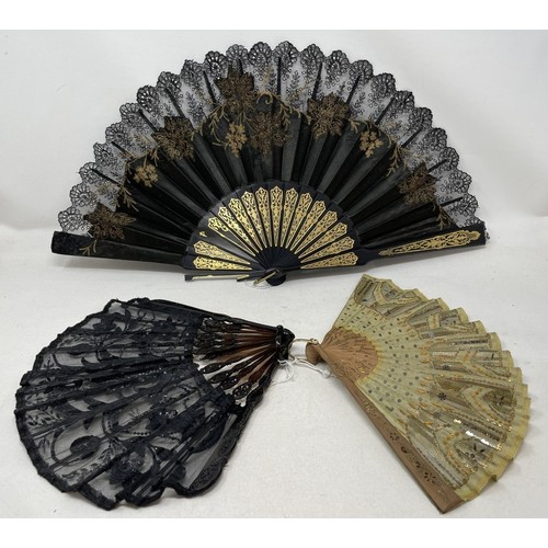 808 - A painted wooden fan, painted a tavern scene, 29 cm, and four other fans (5)