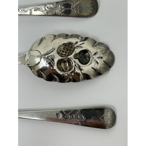 318 - A pair of George III silver spoons, later decorated, and another spoon, 5.6 ozt (3)