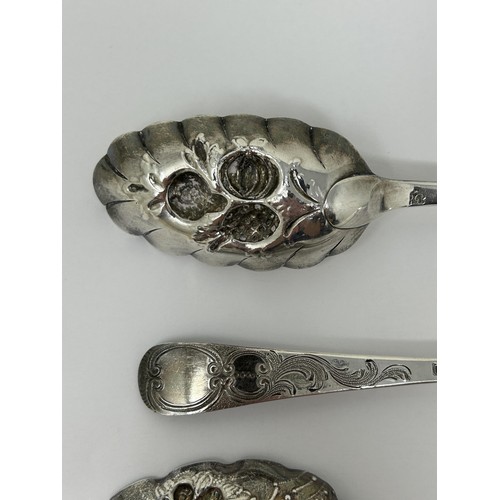 318 - A pair of George III silver spoons, later decorated, and another spoon, 5.6 ozt (3)