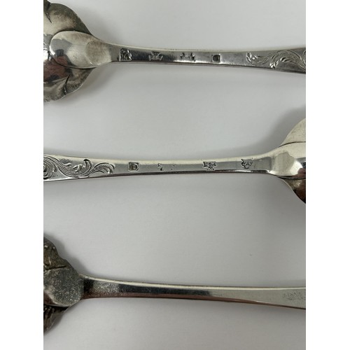 318 - A pair of George III silver spoons, later decorated, and another spoon, 5.6 ozt (3)