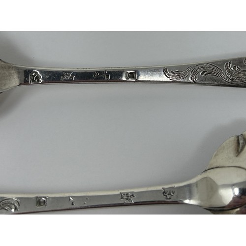 318 - A pair of George III silver spoons, later decorated, and another spoon, 5.6 ozt (3)