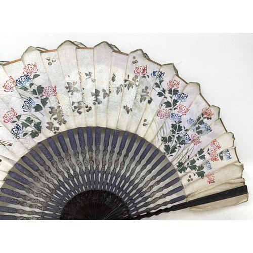 809 - A mother of pearl fan, silk painted flowers, 30 cm, and three others (4)