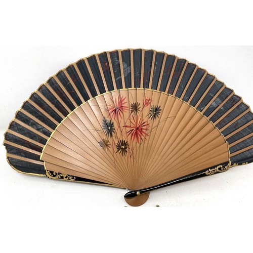 817 - A carved wood fan, silk painted flowers, 25 cm, boxed, and three other fans (4)