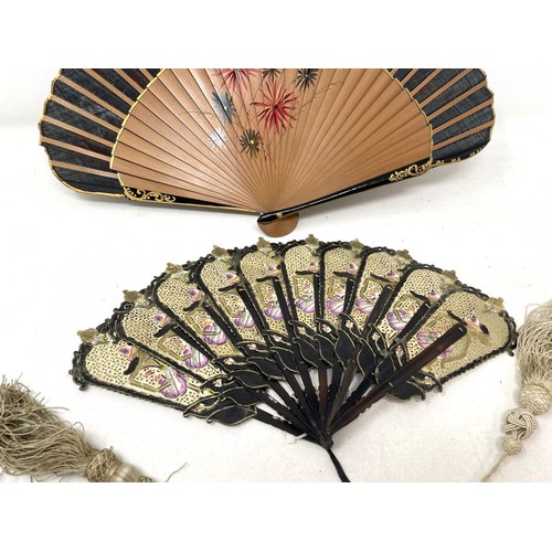 817 - A carved wood fan, silk painted flowers, 25 cm, boxed, and three other fans (4)