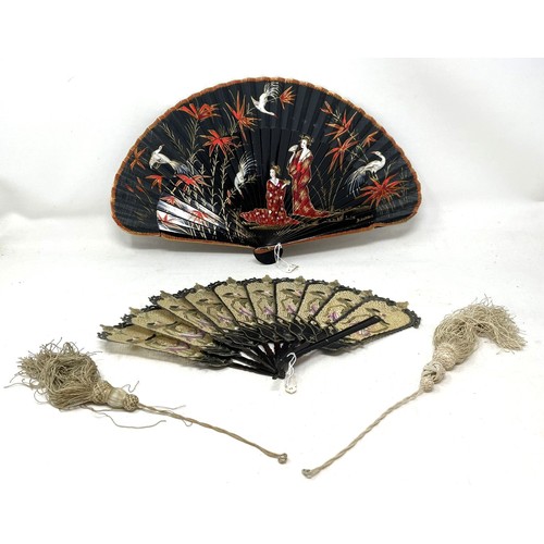 817 - A carved wood fan, silk painted flowers, 25 cm, boxed, and three other fans (4)