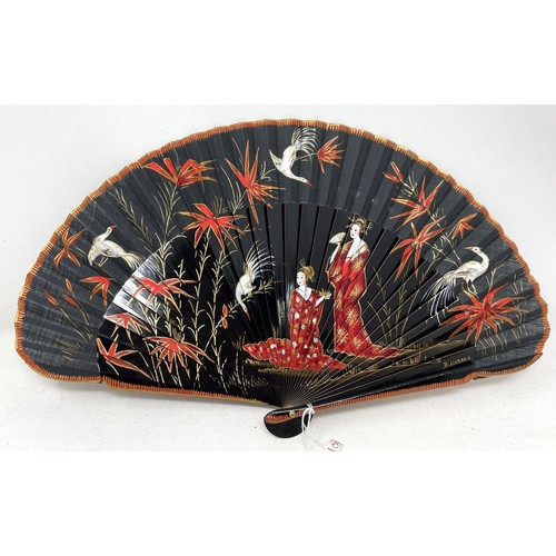 817 - A carved wood fan, silk painted flowers, 25 cm, boxed, and three other fans (4)