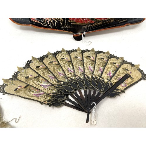 817 - A carved wood fan, silk painted flowers, 25 cm, boxed, and three other fans (4)