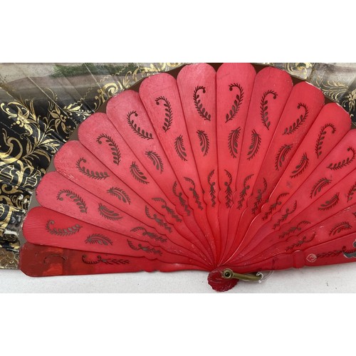 817 - A carved wood fan, silk painted flowers, 25 cm, boxed, and three other fans (4)