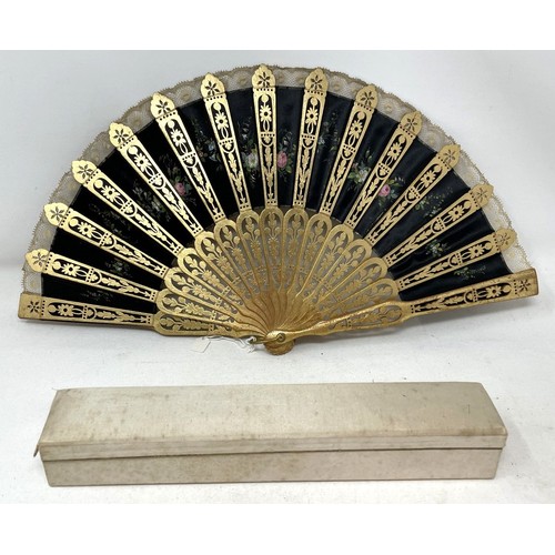 817 - A carved wood fan, silk painted flowers, 25 cm, boxed, and three other fans (4)