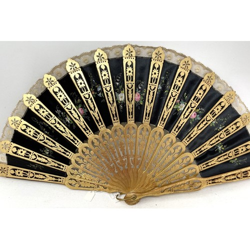 817 - A carved wood fan, silk painted flowers, 25 cm, boxed, and three other fans (4)