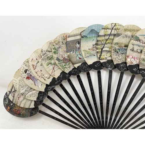 819 - A painted fan, the paper decorated print of military leaders, 23 cm, and four others (5)