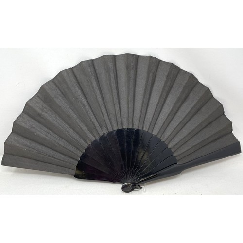 820 - An ebonised fan, the silk painted flowers, 25 cm, boxed, and five other fans (6)