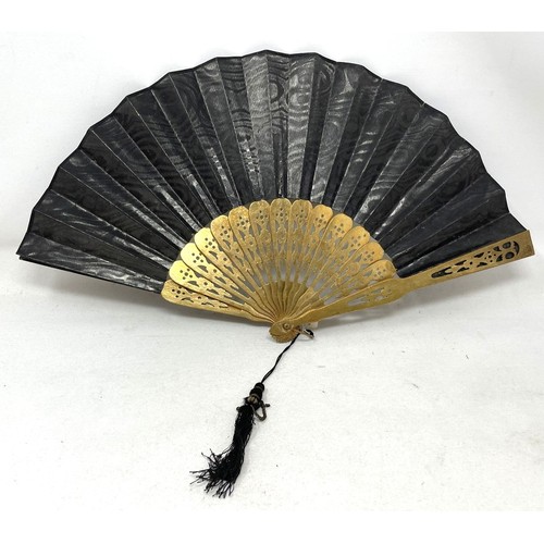 820 - An ebonised fan, the silk painted flowers, 25 cm, boxed, and five other fans (6)