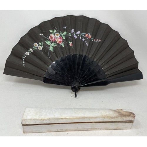 820 - An ebonised fan, the silk painted flowers, 25 cm, boxed, and five other fans (6)