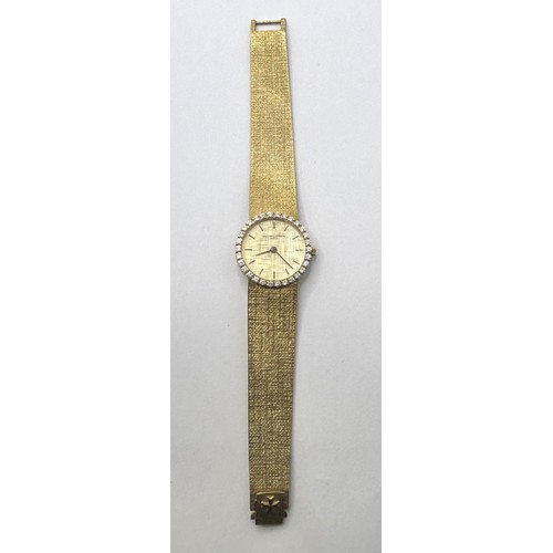 388 - A ladies 18ct gold Vacheron & Constantin wristwatch, with a diamond bezel, all in 60 g