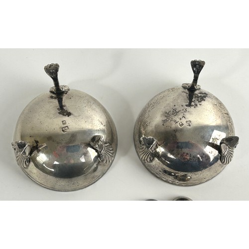 304 - A pair of Continental silver coloured metal salts, raised on legs with lions paw feet, and a pair of... 