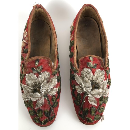 824 - A pair of late 19th/early 20th century beadwork slippers, decorated flowers