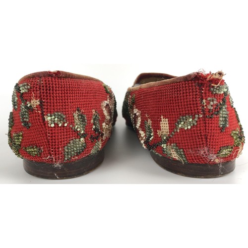 824 - A pair of late 19th/early 20th century beadwork slippers, decorated flowers